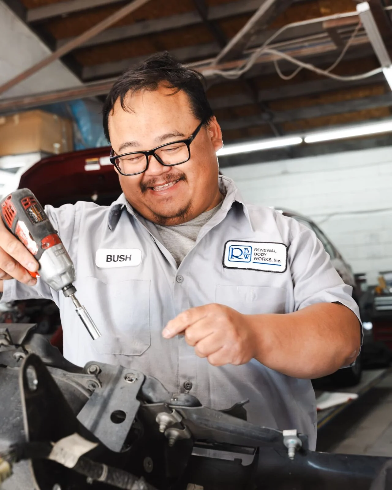 Bush, technician at Renewal Body Works, reassembling a bumper support