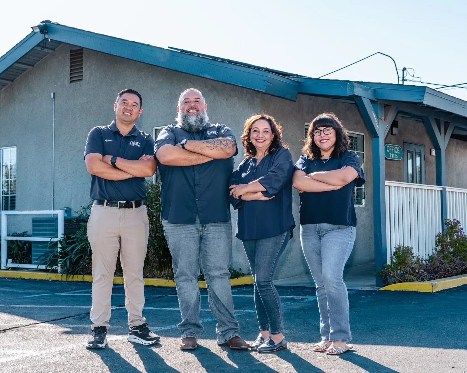 Renewal Body Works front office team outside the Clovis office